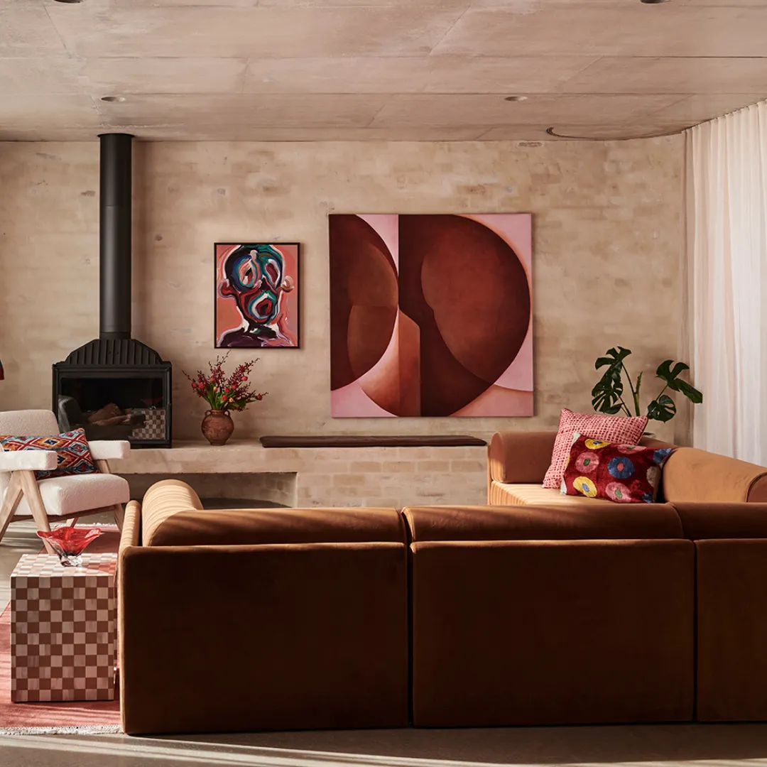 Red Earth — a burgundy geometric abstract painting styled above a fireplace